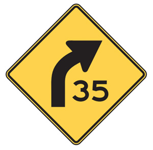 Figure 14 Advanced warning sign - Yellow advisory signs warn motorists that an upcoming corner may require a speed reduction (MUTCD, 2009).