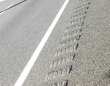 Figure 13 Rumble strip - These grooves along the shoulder of a highway in Spanish Fork, Utah make an audible sound when driven across. This sound can alert a drowsy or distracted driver.