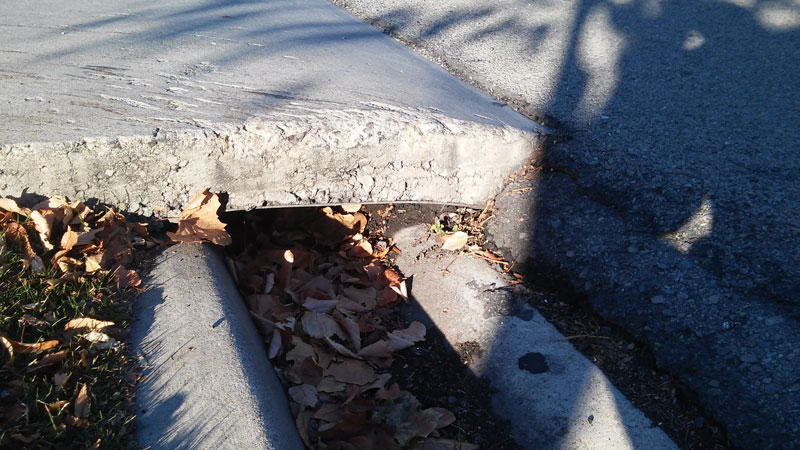 An example of deep gutter "Provo curb" which may distract drivers exiting and entering driveways.